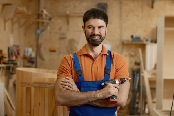 depositphotos_758474776-stock-photo-portrait-smiling-man-carpenter-coveralls